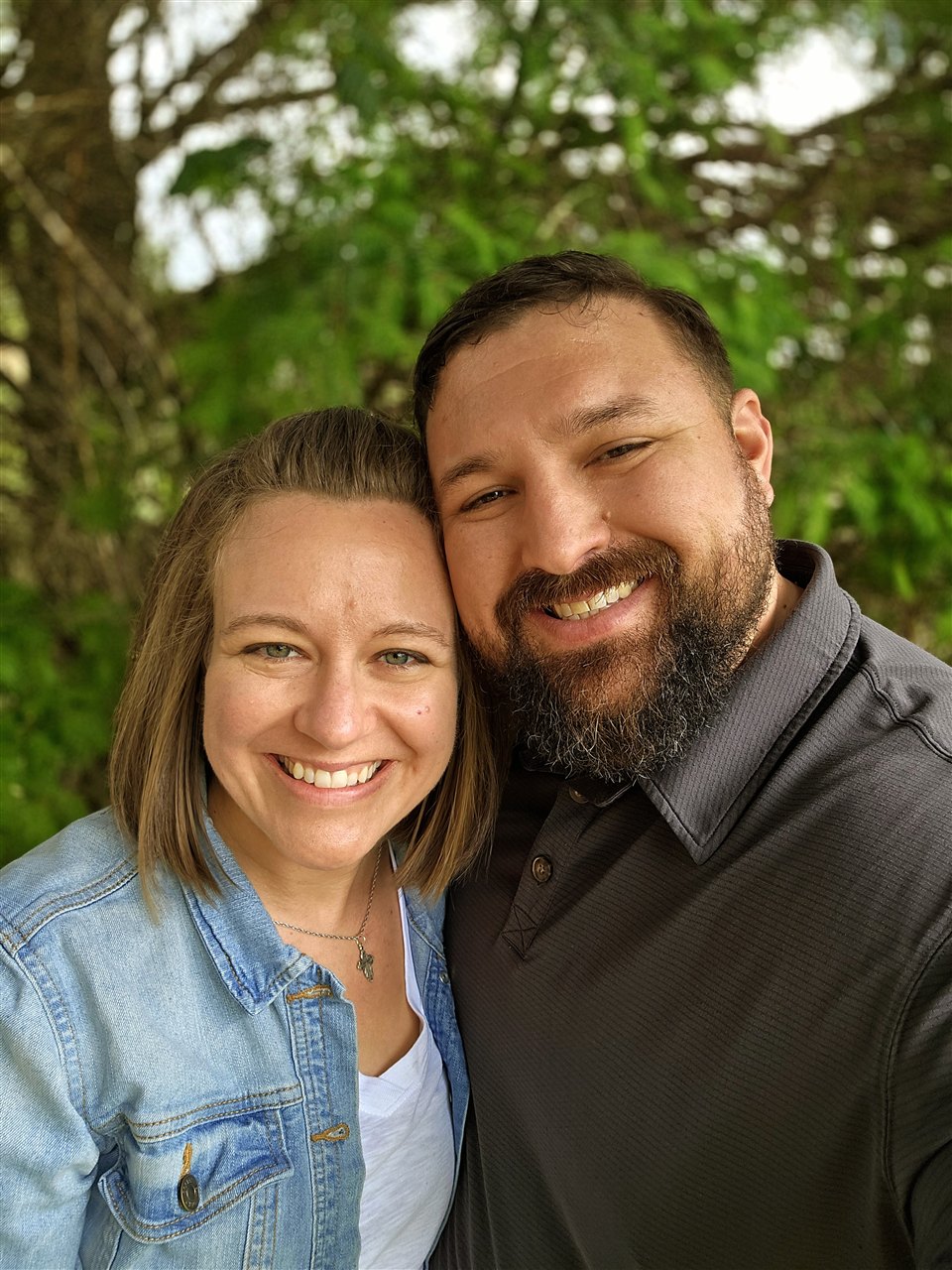 Stephanie and Joel smiling together outdoors